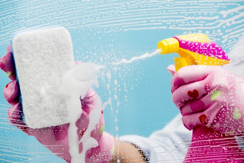 Local upholstery cleaner treating stains on a sofa
